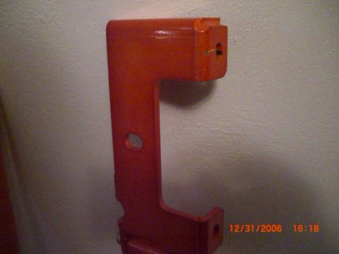 1993 Ford Probe - An orange metal bracket is shown against a wall, with a timestamp and website visible in the lower right corner.