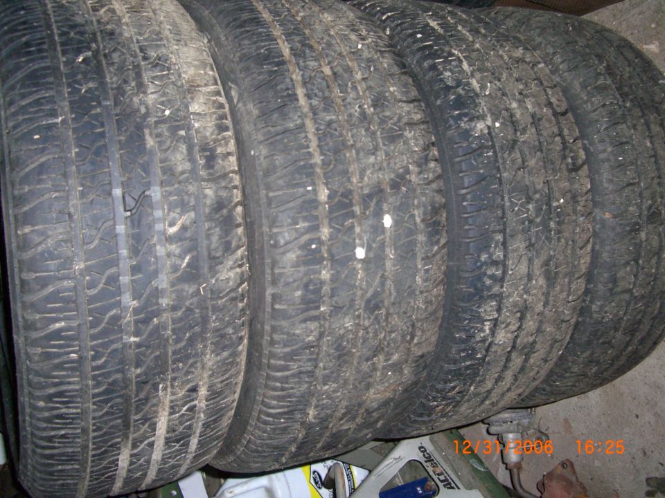 Four used tires stacked