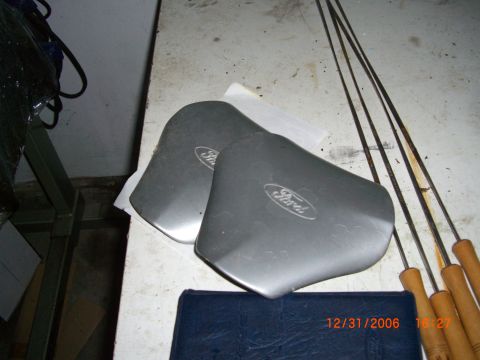1993 Ford Probe - Two Ford-branded car parts are shown, possibly for sale.