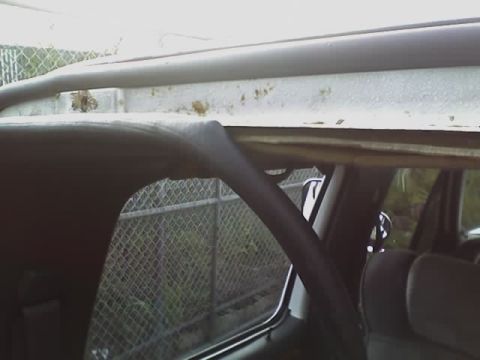 1993 Ford C-350 (Centurion Conversions) - Interior view of a vehicle, focusing on the headliner and a seat.