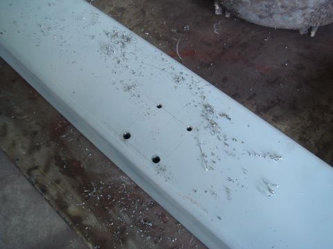 1996 Ford Bronco - A metal beam shows evidence of recent drilling and metal shavings.
