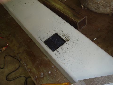 1996 Ford Bronco - Metal beam with a square hole cut into it, possibly for a component.