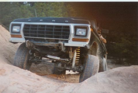 1978 Ford Bronco - This 1978 Ford Bronco is captured mid-climb on a sandy incline, its off-road capabilities.