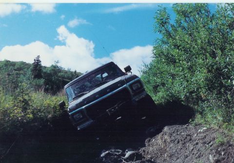 1978 Ford Bronco - 1978 Ford Bronco navigating a challenging off-road trail.