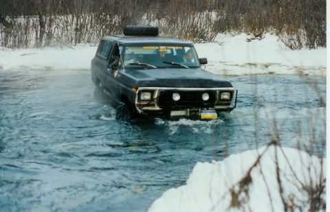 1978 Ford Bronco - This 1978 Ford Bronco is navigating a water crossing during a snowy season.