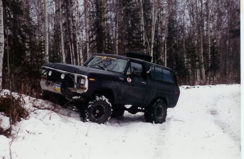 1978 Ford Bronco - This 1978 Ford Bronco is navigating a snow-covered path in a wooded area.
