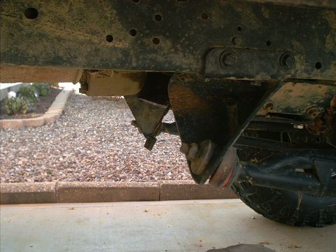 1978 Ford Bronco - Undercarriage view shows suspension components and frame of a vehicle.