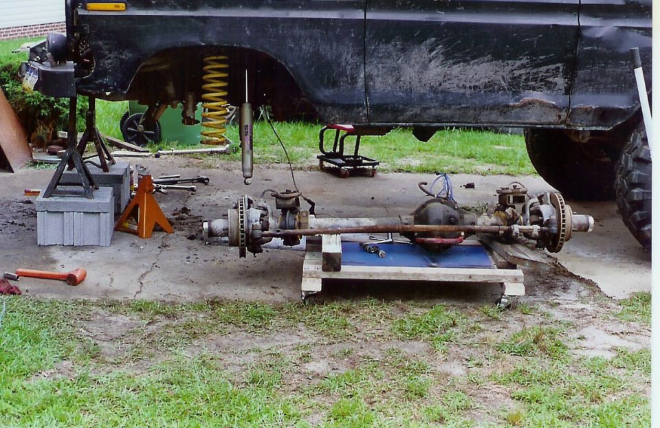 Vehicle front and rear axles removed, with suspension components visible