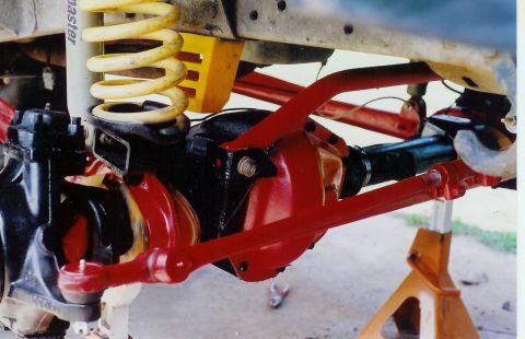 1978 Ford Bronco - Close-up view of off-road vehicle suspension and drivetrain components, including a differential and springs.