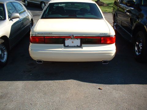 1996 Mercury Grand Marquis - The rear of a 1996 Mercury Grand Marquis, dual oblong exhaust tips and a Maryland license plate.