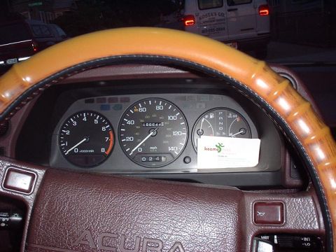 1997 Ford Crown Victoria - Interior view of a car's dashboard, showing the steering wheel and instrument cluster.