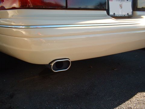 1996 Mercury Grand Marquis - The rear of a 1996 Mercury Grand Marquis shows a single, chrome-trimmed oblong exhaust tip.