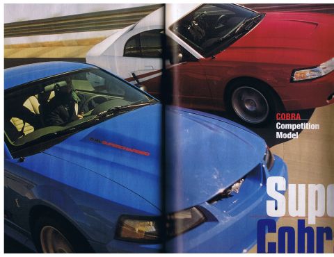 2003 Mercury Marauder - Two Ford Mustang Cobras, one blue and one red, are shown on a race track with text indicating 'COBRA Competition Model'.