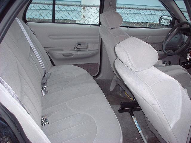 1997 Ford Crown Victoria interior showing front passenger seat and rear bench seat