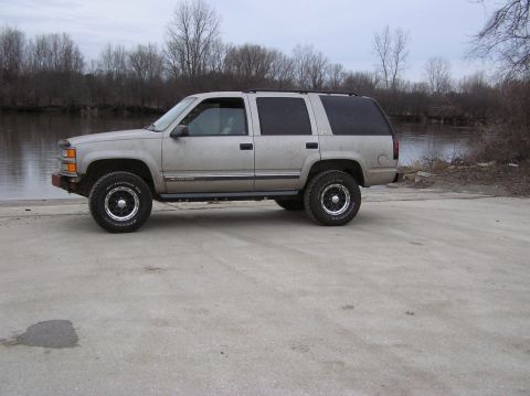 2000 Chevrolet Tahoe - This 2000 Chevrolet Tahoe is seen parked next to a calm body of water on an overcast day.