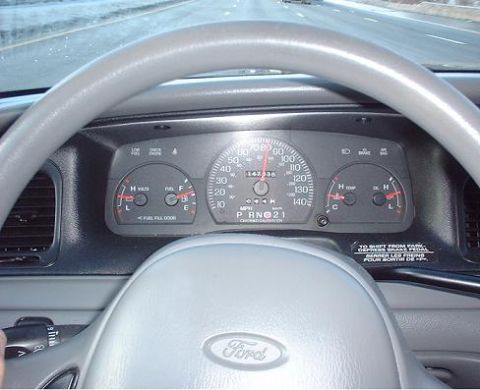 1997 Ford Crown Victoria - Interior view of a Ford Crown Victoria, showing the dashboard gauges and steering wheel.