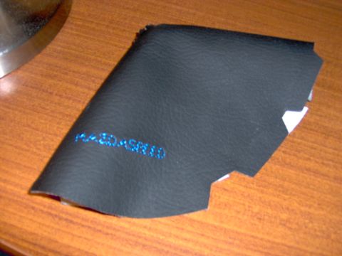 1993 Ford Probe - Black leather automotive part with blue text 'F43-30-ASR10' visible.