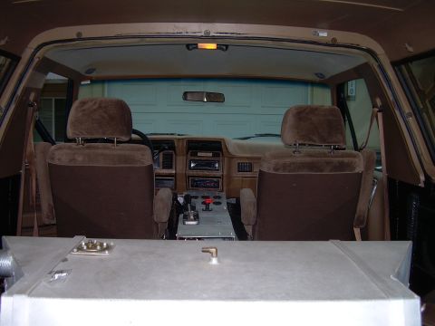 1986 Ford Bronco - Interior view of a 1986 Ford Bronco, focusing on the dashboard and seating area.