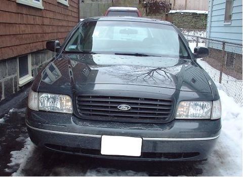 1997 Ford Crown Victoria - Front view of a 1997 Ford Crown Victoria parked outside in the snow.