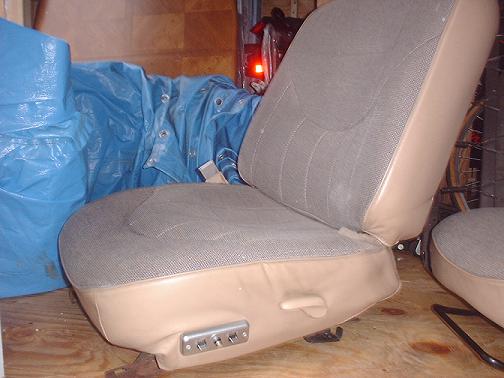 Tan and grey fabric car seat with power controls
