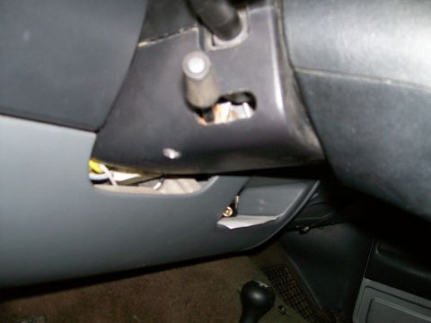 1992 Ford Bronco - Close-up view of the interior dashboard and steering column, revealing exposed wiring and components.