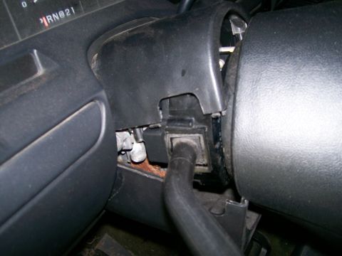1992 Ford Bronco - Interior view of a 1992 Ford Bronco's steering column and dashboard components.