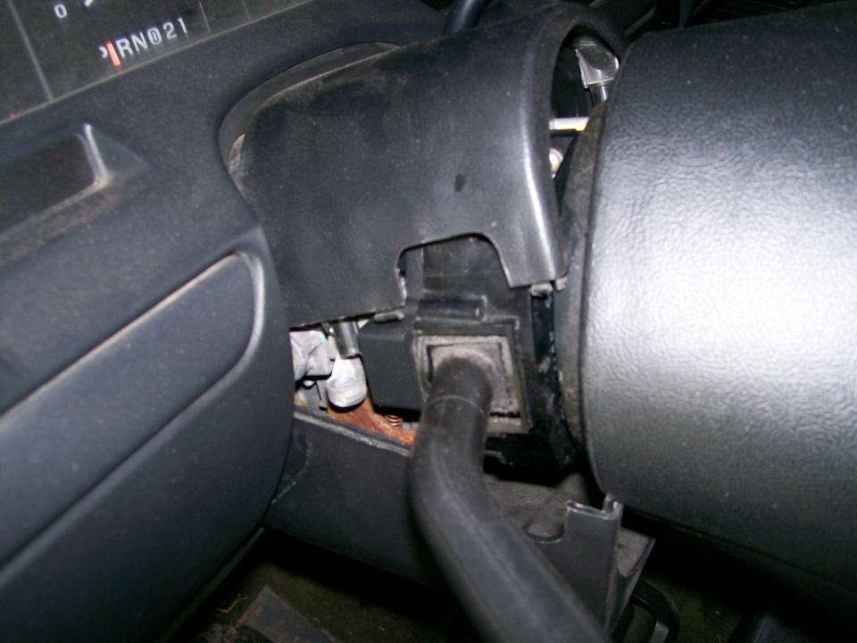Steering column with shroud removed showing shift linkage, wiring and PRN21 gear indicator