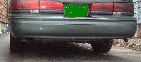 1997 Ford Crown Victoria - The rear of a 1997 Ford Crown Victoria shows its taillights and bumper.
