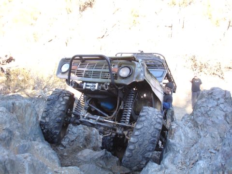 1984 Ford Bronco - This heavily modified off-road vehicle navigates a rocky terrain with impressive articulation.