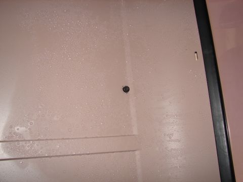 1996 Ford Bronco - Water droplets cover the interior panel of the vehicle.