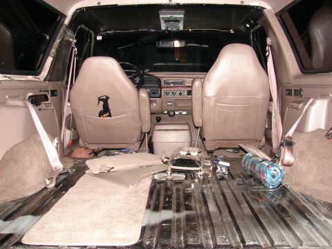1996 Ford Bronco - The interior of the vehicle appears to be undergoing some form of modification or repair, with parts disassembled.