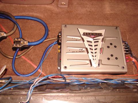 1996 Ford Bronco - Car stereo amplifier and wiring are installed in the vehicle's interior.