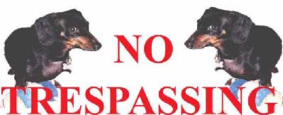 1997 Ford Crown Victoria - A humorous sign features two dachshunds with a 'NO TRESPASSING' warning.