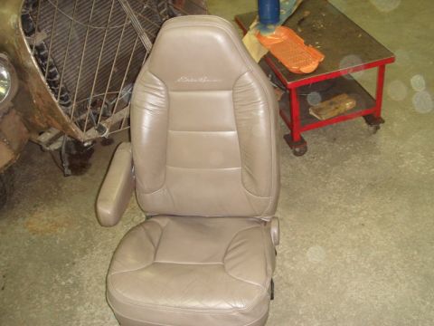 1996 Ford Bronco - Driver's seat with 'Eddie Bauer' embroidery, likely removed for repair or replacement.