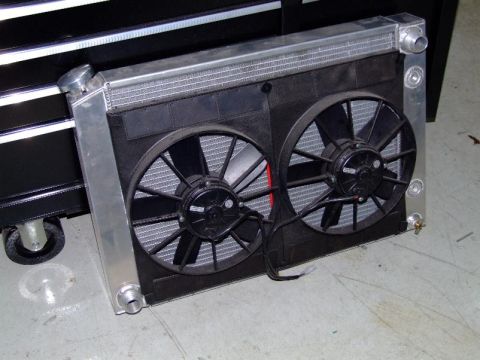 1990 Ford Mustang - Radiator and dual electric fans assembly, likely an aftermarket upgrade part.