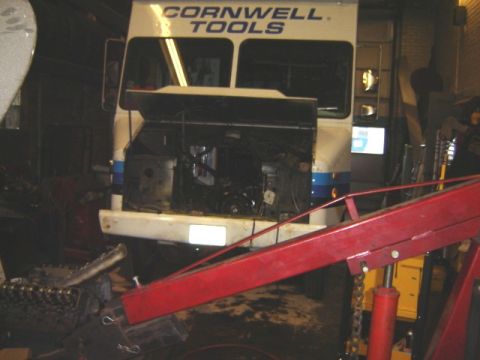 1992 Ford Bronco - Cornwell Tools truck in a workshop, engine compartment open and accessible.