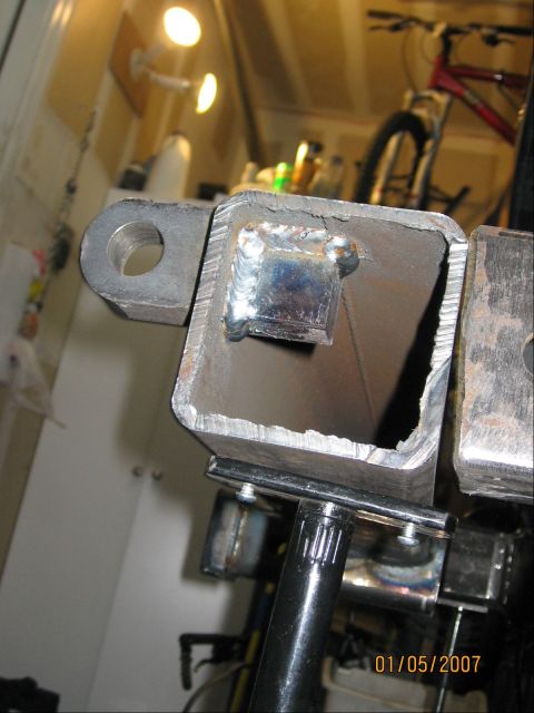 1994 Ford Bronco - Close-up of a custom-welded metal hitch receiver part, showing the raw metal and welding details. The date 01/05/2007 is visible in the low…