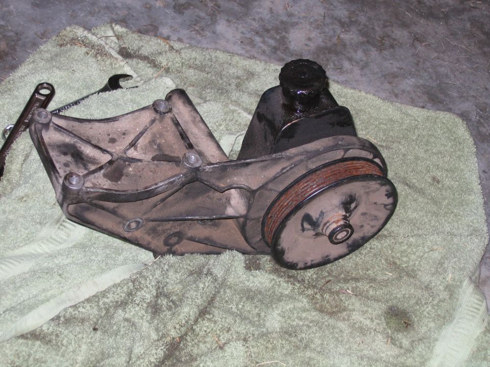 Power steering pump and bracket on towel