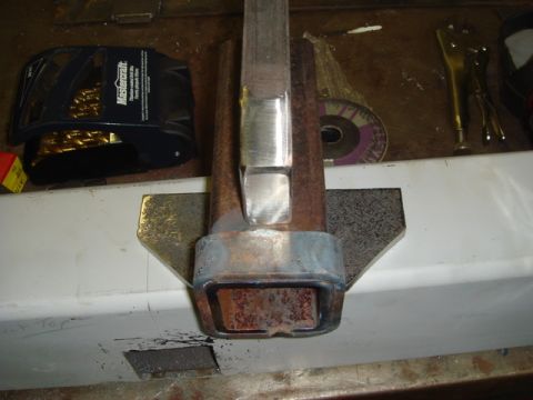 1996 Ford Bronco - Metal fabrication work in progress, showing tubing secured in a vise with welding equipment visible.