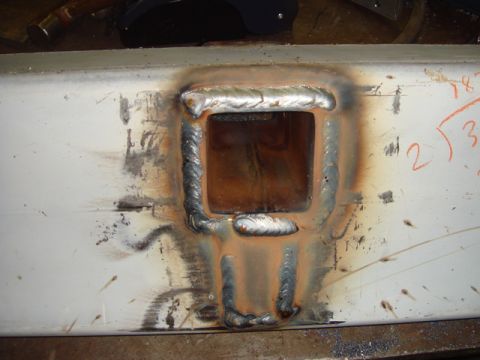 1996 Ford Bronco - A close-up view of a welded metal component, showing the results of fabrication work and some handwritten mathematical notations.