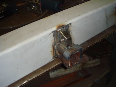 1996 Ford Bronco - Custom welded trailer hitch receiver mounted on a beam, with tools visible in the background.