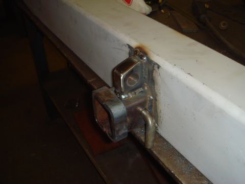 1996 Ford Bronco - A custom metal bracket is welded onto a frame, a bent rod for attachment.