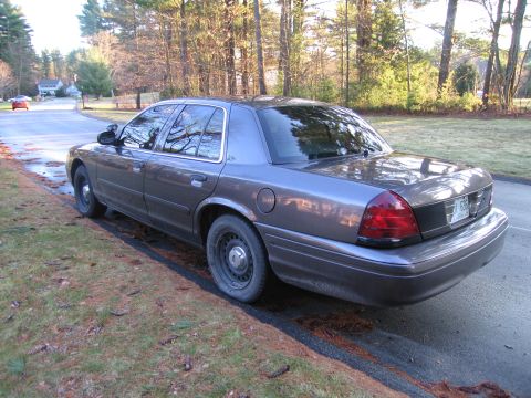 1991 Ford LTD Crown Victoria - This 1991 Ford Crown Victoria police car is parked on the side of a residential street.