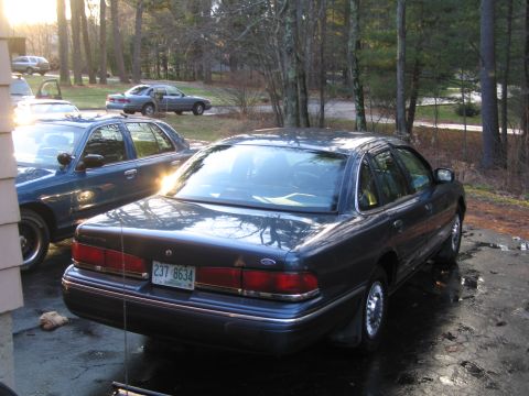 1991 Ford LTD Crown Victoria - Rear view of a 1991 Ford Crown Victoria LTD, showing its distinctive taillights and license plate.