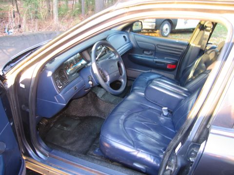 1991 Ford LTD Crown Victoria - Interior of a 1991 Ford Crown Victoria LTD police car, with a second vehicle visible through the window.