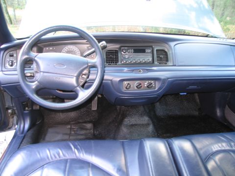 1991 Ford LTD Crown Victoria - Interior view of a 1991 Ford Crown Victoria LTD, showing the dashboard, steering wheel, and seats.
