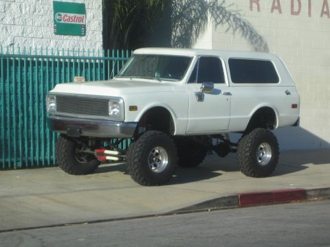 1968 Ford Mustang - White 1972 Chevrolet K5 Blazer with large off-road tires and suspension lift.