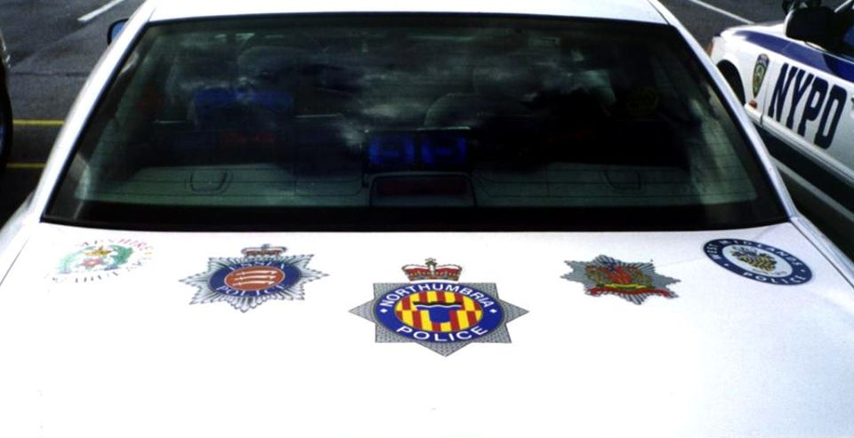 Check out these badge stickers from various police departments in the UK (on the Orange County Vic's trunk lid).
