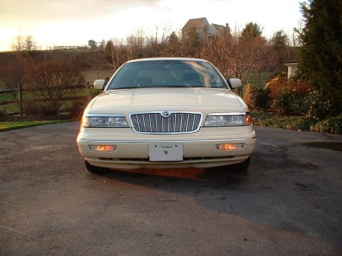 1996 Mercury Grand Marquis - A 1996 Mercury Grand Marquis is seen from the front in a driveway during golden hour.