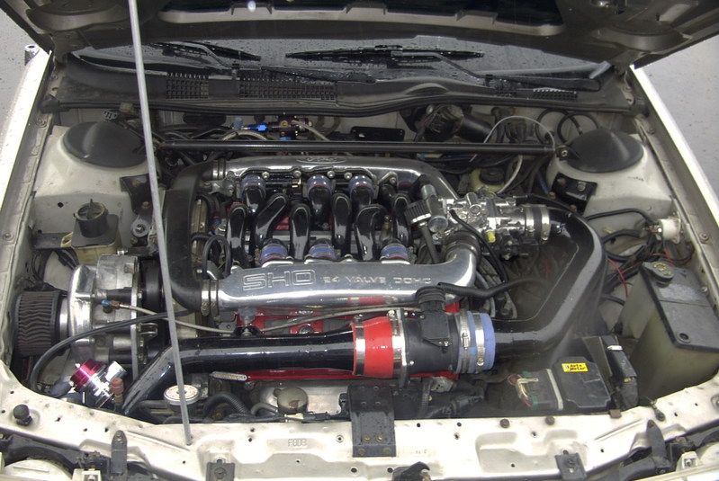 engine bay with SHO 24 VALVE DOHC intake manifold and turbocharger components